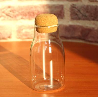 China High Temperature Resistance Mini Size 180ml Cute Glass Water Bottle With Cork Lid For Heat Resistant Storage And Gift for sale