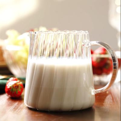 China Sustainable Hot Selling 600ML Borosilicate Glass Strip Milk Cup With Handle for sale