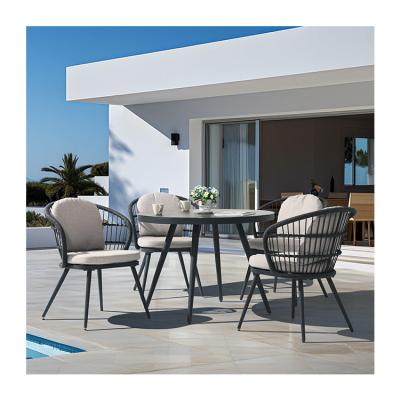 China Courtyard Outdoor Dining Set with Round Tempered Glass Table and Rope Weave Armchair for sale