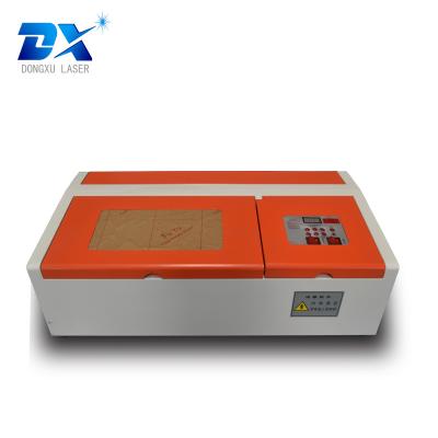 China Laser Engraving Mini Laser Cutter Machines CO2 40w With Long Life For Cutting Number Materials for sale