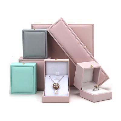 China Small logo jewelry box handmade high quality custom plastic packaging leather jewelry box gift box for sale