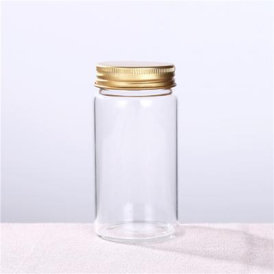 China Spirits Liquor Low Price Round High Borosilicate Glass Water Bottle With Lid for sale