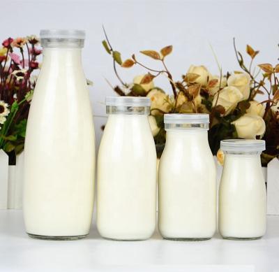 China Food Wholesale Price 100ml 200ml 250ml 500ml 100ml Round Milk Bottle Transparent Glass for sale