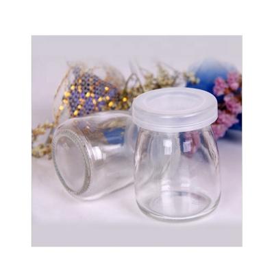 China Milk factory supply high quality round 100ml bottle glass with pe lid for sale