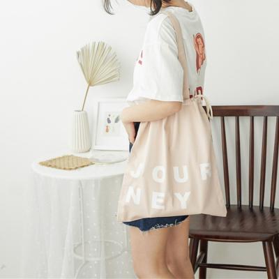 China Heli Natural Solid Color Letter Handled Printing Canvas Tote Bag With Drawstring for sale