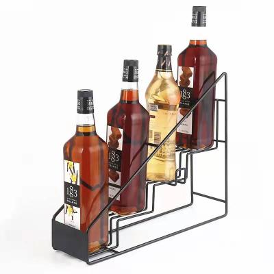 China Sustainable Four Tier Metal Syrup Merchandisers Wine Bottle Display Rack Stands Black Coffee Syrup Storage Rack for sale