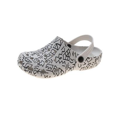 China Shock-absorbent Outdoor Flat Bottom Ladies Beach Semi-slippers European And American Fashion Camouflage Graffiti EVA Baotou Cave Garden Shoes for sale