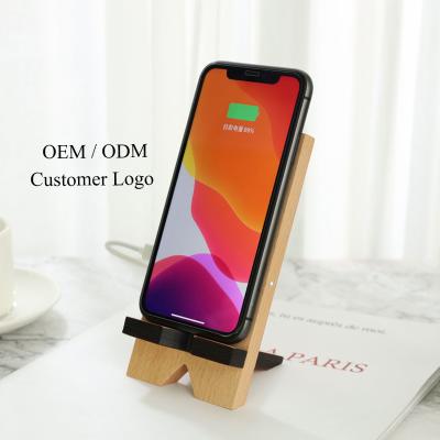 China OEM ODM Resin Wooden Foldable Mobile Stand Cover Foldable Wireless Phone Charger Stand For iPhone for sale