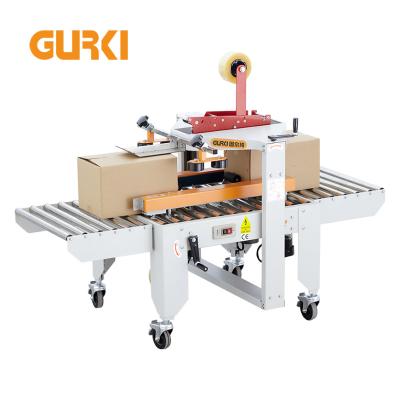 China Automatic CLOTHING Box Taper Case Carton Sealer Packing Machine Automatic Box Taping Carton Sealing Machine for sale