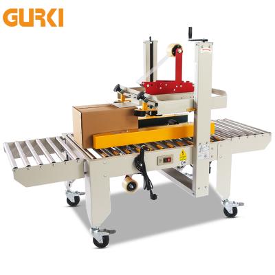 China CLOTHING GURKI Long Service Life Easy To Operate Cardboard Packing Machine for sale