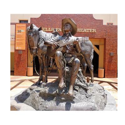 China Famous bronze statue American Western Europe Gene Autry playing guitar on the street for sale