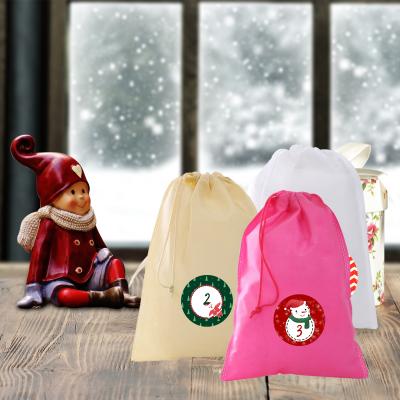 China Handmade DIY Christmas Returns Reusable Christmas Countdown Decorations Wholesale Christmas 2021 Advent Calendar 24 Days Hanging Drawstring Candy Bags With Stickers for sale