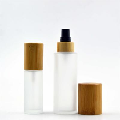 China Personal Care 100ml Round Shoulder Glass Bottles With Lotion Pump Bottle Perfume Bottle for sale