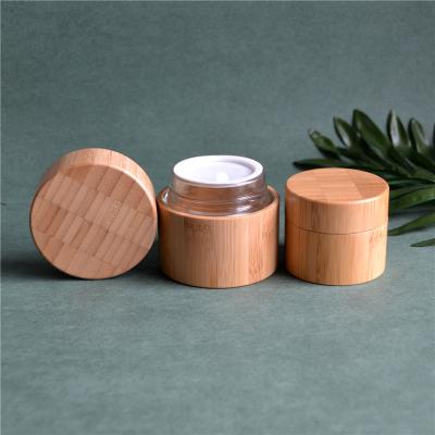 China 30g 50g 100g Eco-friendly stock plastic cosmetic packaging bamboo cream jar with glass interior for sale