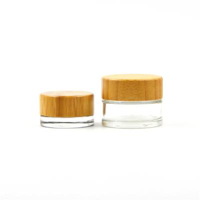 China Recyclable Material Environmental Friendly Clear Cosmetic Glass Jar With Bamboo Lid Bamboo Cosmetic Packaging for sale