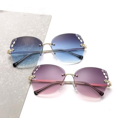 China Fashion Sunglasses Trending Ocean Color Sunglasses Luxury Round Rhinestone Frameless Sunglasses for sale