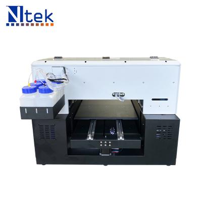 China Ntek Indoor Outdoor UV Flatbed Printer Advertising Printing Machine Mini Printing Size for sale