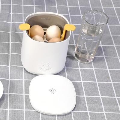 China Boils up to eggs 4 electric egg cooker boiler XJ-12896 hard boiled electric egg boiler steamer for sale