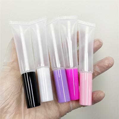 China cosmetics & Osmo Wholesale Private Logo 15ml Makeup Magic Wands Empty Lip Gloss Squeeze Tubes Lip Gloss Squeeze Tube With Brush Head for sale