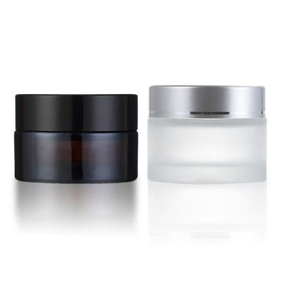 China Brown Recyclable Glass Face Cream Jar With Black Lid Sealed Cosmetic Packaging Jar for sale