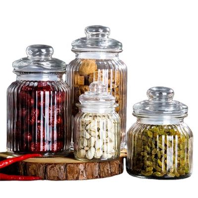 China Freshness Preservation Grain Candy Transparent Vertical Strip Glass Storage Jar With Glass Cover for sale