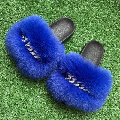 China Fashion Raccoon Fur Slippers Sandals Fur Slides Furry Women's Sandals Large Fashion Trend High Quality Real Fur Flat Sandals With Chain for sale