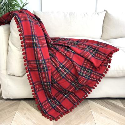 China Decorative Goods Stretching Plaids Throw Blankets Pom Pom Trimmed Christmas Throw Blankets for sale