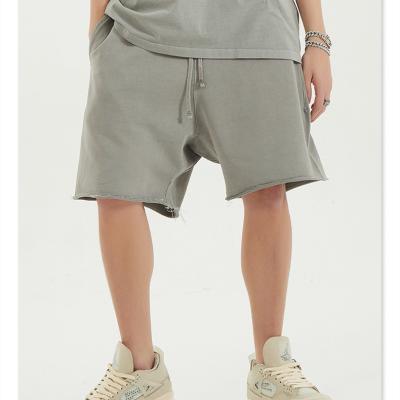 China Anti-wrinkle 2022 summer solid color loose edge spring and retro washed shorts high street loose edge wide leg cropped men's shorts for sale