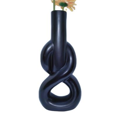 China Hot-selling minimalist over the whole design Nordic simple modern ceramic U-shaped creative art atmosphere lattice ceramic round tube vase for sale