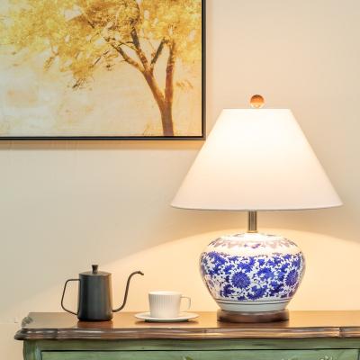 China Simple modern hotel blue ceramic porcelain desk lamp luxurious handcrafted and white living room the bedroom the head of a bed lamp manufac for sale