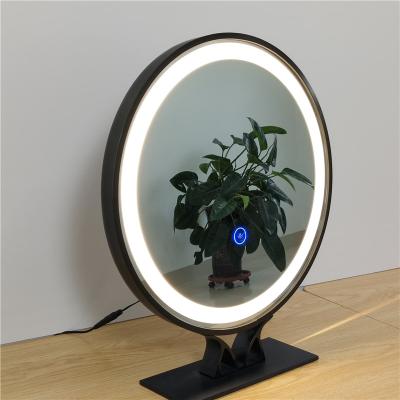 China Large minimalist touch screen demisting control makeup wall hanging black luminous smart led mirror with a frame with base for sale