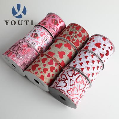 China Coloful Viable Satin Wide Heart Lettering Print Ribbon Glitter Designer Ribbon Rolls Colored Ribbon for sale