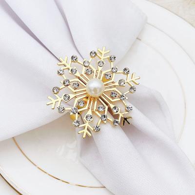 China Wholesale Viable High Quality Napkin Ring Gold Diamond Napkin Buckle Christmas Snowflake Hotel Napkin Rings Gold Accessories for sale