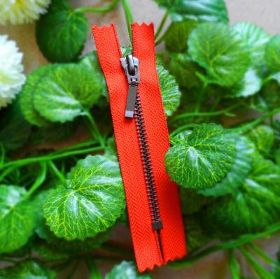 China Customized Closed End Zipper #5 With Auto Lock Slider , Long Puller And Red Tape for sale