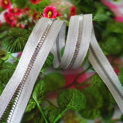 China Long 5# Resin Zipper Silver Light Plastic Teeth For Garment for sale