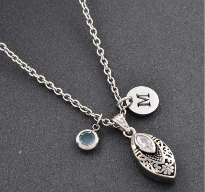 China Leaf-shaped Cremation Jewelry Necklace with Chrysanthemum Engraving and Birthstone OEM/ODM for sale