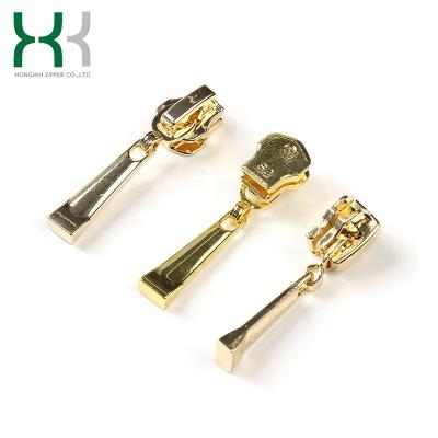 China OEM No.5 Nickel Free Custom Gold Factory Elegant Garment Pull Auto Lock Metal Zipper Slider for sale