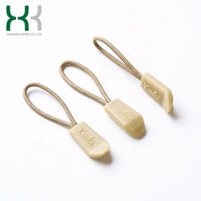 China Newly designed nickel free durable plastic rubber zipper puller with customized logo for sale