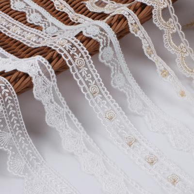 China Sustainable Hot Selling Fashion Hollow Out Gold Embroidery Applique Border Lower Lace Trimmings for sale