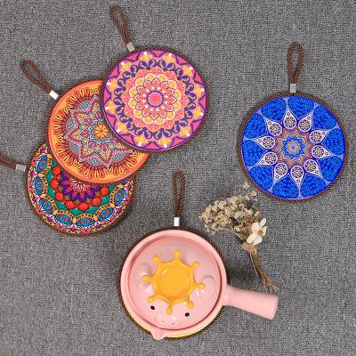 China Viable Ceramic Kitchen Cork Potholders Home Dining Mat Around Ceramic Pot Mat Creative Coaster for sale