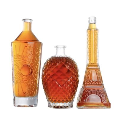 China Beverage Custom special shape iquor glass bottle premium flint glass 700ml 750ml vodka whisky tequila spirit glass bottle with stopper for sale