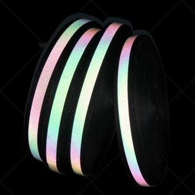 China Hoge zichtbaarheid Regenboogstrook Reflectief stof met zwart lint 25 mm*100 m per rol Te koop