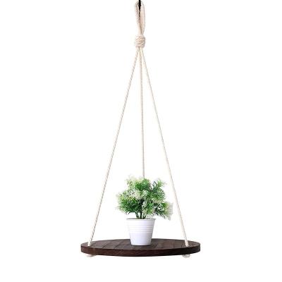 China Dark Brown Handmade Home Hanging Wooden Shelf For Plants Rustic Paulownia Wood Shelf With Cotton Rope for sale