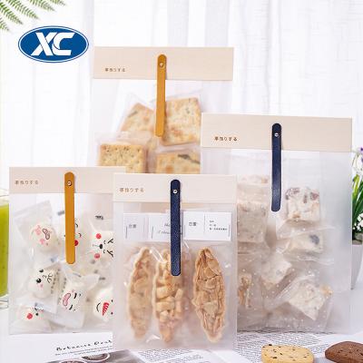 China Recyclable Small Plastic Cake Bag Plastic Christmas Snack Candy Holder Food Gift Bags With Wooden Clip for sale