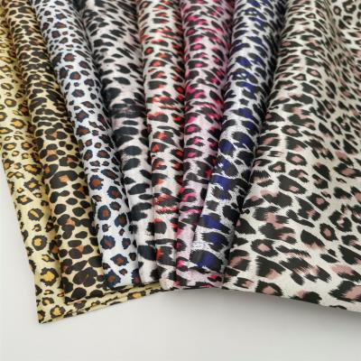 China Fusible Ready Goods Silk Satin Leopard Print Fabric With Many Design For Costume for sale