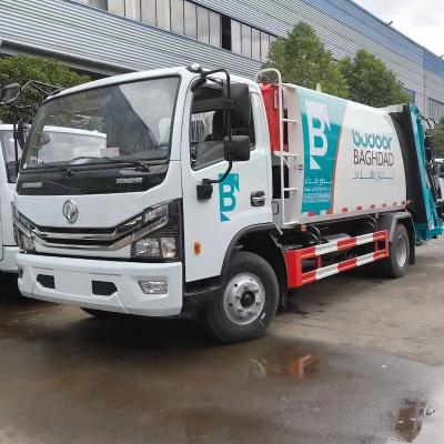 China Nieuwe China vuilniswagen 6-8 CBM DONGFENG compacte vuilniswagens Te koop