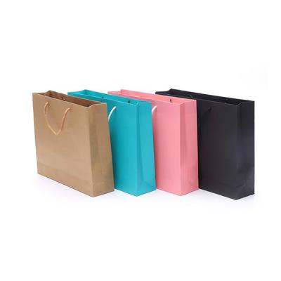 China Long Handled Cardboard New Year Blue Pink Custom Paper Gift Packaging Luxury Shopping Bags For Sunglasses for sale