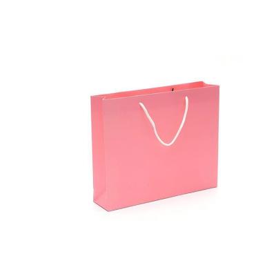 China Recyclable Customized Cute Pink Paper Shopping Gift Bag With Handles for sale