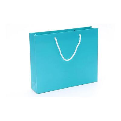 China Recyclable Custom Printing Gift Blue Kraft Paper Bags With Handles for sale