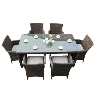 China Durable / Waterproof Garden Rattan Wicker Chair Set Outdoor Dining Furniture Cushioning Tempered Glass Table for sale